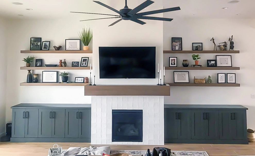 A beautiful custom living room floating shelf and mantle that was designed, built and installed by Haggerty Construction.